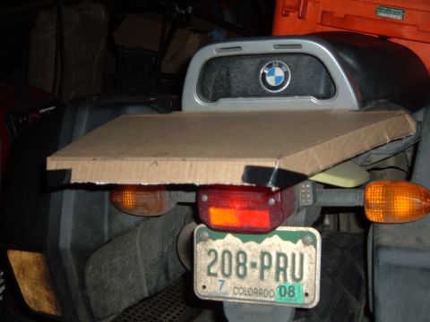 1998 BMW R1100GS ABS - A temporary cardboard rack extension is attached to the rear of a motorcycle, obscuring the license plate.