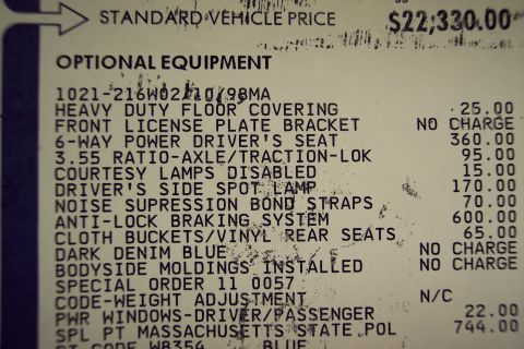 2001 Ford Crown Victoria - Vehicle window sticker details optional equipment and pricing for a car.