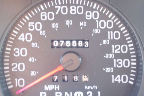 2001 Ford Crown Victoria - The odometer reads 75,583 miles, with the speedometer needle pointing towards 70 MPH.