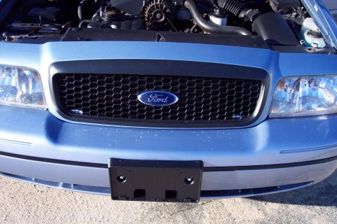 2001 Ford Crown Victoria - Front view of a blue 2001 Ford Crown Victoria, showing the grille, headlights, and engine bay.