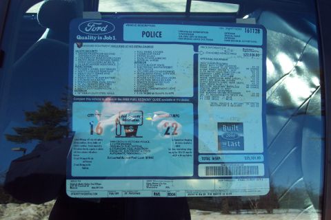 2001 Ford Crown Victoria - A Ford window sticker details the features and price of a 1999 Crown Victoria Police Interceptor.