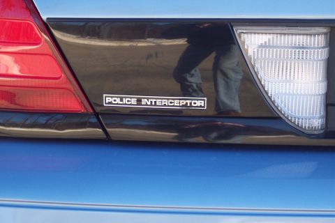 2001 Ford Crown Victoria - Rear view of a 2001 Ford Crown Victoria showing the Police Interceptor badge.