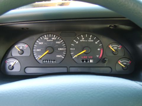 1996 Mercury Grand Marquis - Close-up of car dashboard gauges, including speedometer and tachometer.