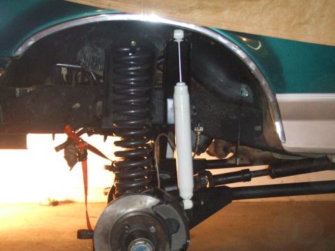 1996 Ford Bronco - Front suspension and fender well of a 1996 Ford Bronco during a modification.