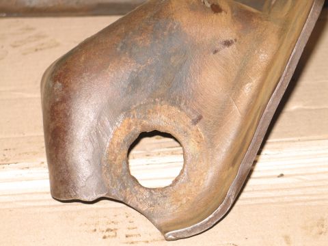 1995 Ford Bronco - This is a close-up of a metal part, likely a bracket, showing signs of rust and wear.