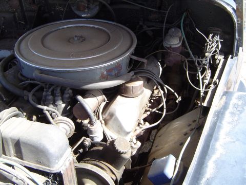 1989 Ford Bronco - Close-up view of the engine bay, showing various mechanical parts and wiring.