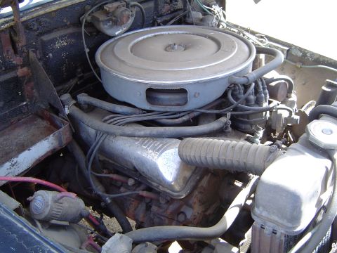 1989 Ford Bronco - Close-up view of a vehicle's engine compartment, showing various engine components.