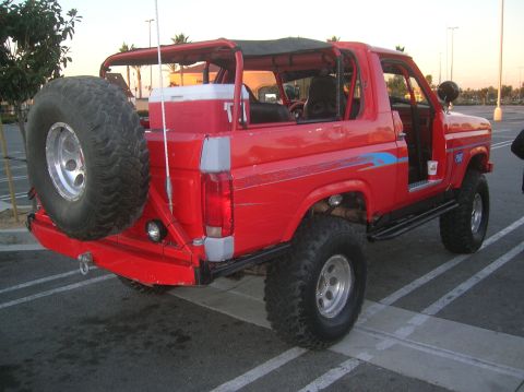 1985 Ford Bronco - This red Ford Bronco appears to be from the early 1980s, not 1985, based on its body style.