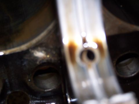 1974 Ford F-100 - This image shows a close-up view of an engine component, likely a bearing or part of the valvetrain, with visible oil staining.