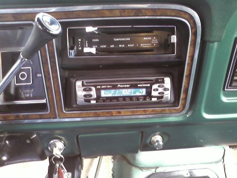 1978 Ford Bronco - Dashboard interior with aftermarket Pioneer stereo and climate controls visible.