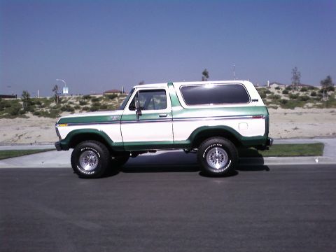1978 Ford Bronco - A two-tone 1978 Ford Bronco is shown from the side under a clear blue sky.