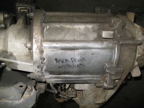 1994 Jeep YJ - A close-up view of a differential housing, which has 'BACK DOOR APPROVED' written on it in marker.