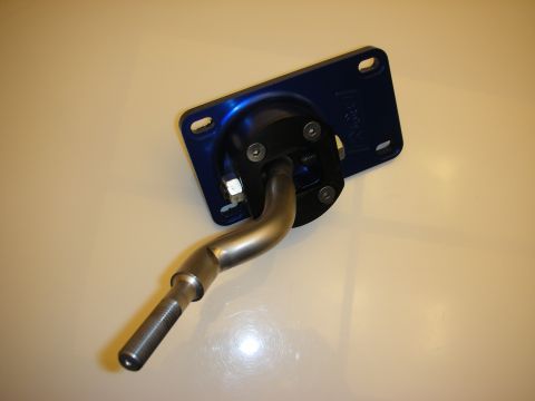 1998 Ford Crown Victoria - blue anodized billet short-throw shifter assembly with a bent steel shift stick, mounted on a base plate on a white table.