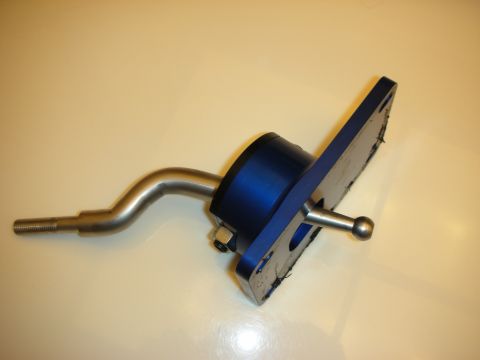 1998 Ford Crown Victoria - Side view of a blue anodized billet short-throw shifter with a bent stick, ball pivot and mounting plate on a white surface.