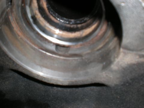 1993 Ford Bronco - This image shows a close-up view of a worn and rusty metal component, likely a part from a vehicle's drivetrain or suspension system.