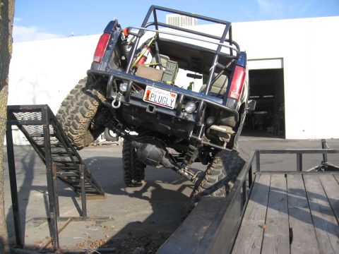 1994 Ford Bronco - Custom off-road truck with extensive modifications, including a roll cage and oversized tires.