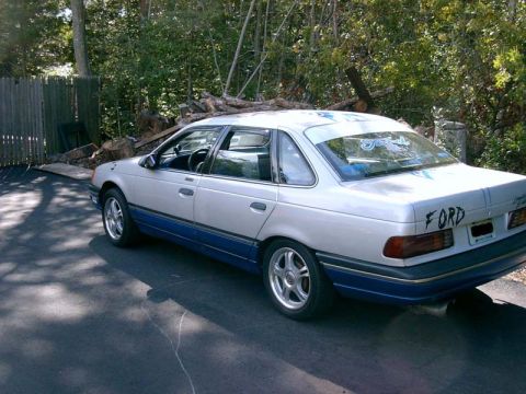 1986 Ford Taurus - This 1986 Ford Taurus sedan is seen from the rear quarter angle, parked outdoors.
