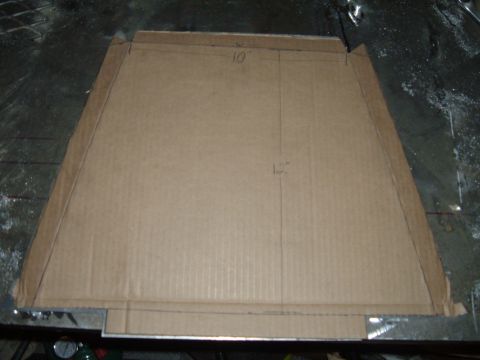 1998 BMW R1100GS ABS - Cardboard template with drawn lines and measurements, possibly for fabricating a motorcycle part.
