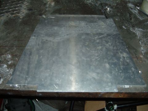 1998 BMW R1100GS ABS - A flat metal plate with visible wear and tear sits on a work surface.