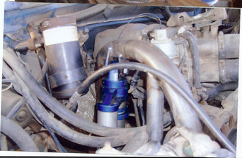 1968 Ford Mustang - Engine bay detail showing ignition coil and associated plumbing.