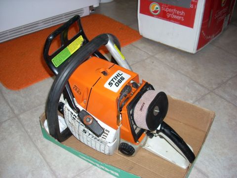 2000 Chevrolet Tahoe - A Stihl 066 chainsaw is shown in its packaging, resting on a cardboard base.