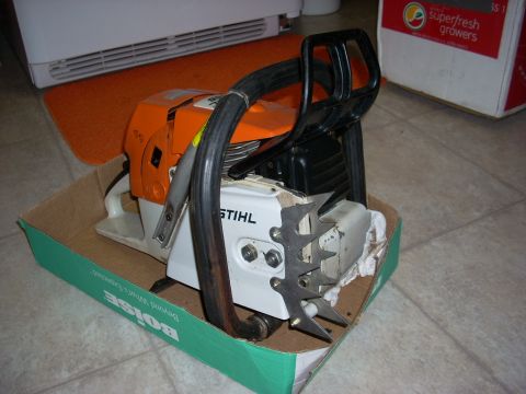 2000 Chevrolet Tahoe - A Stihl chainsaw is shown in its original packaging, resting on a tiled floor.