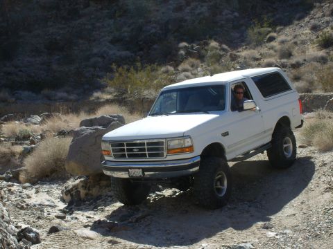1993 Ford Bronco - This 1993 Ford Bronco navigates a desert path, its off-road capabilities.
