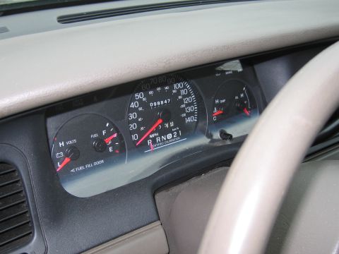 2001 Ford Crown Victoria - The interior of a 2001 Ford Crown Victoria, focusing on the instrument cluster and steering wheel.