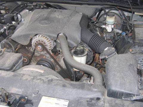 2001 Ford Crown Victoria - The engine compartment of a 2001 Ford Crown Victoria is shown, with various components visible.