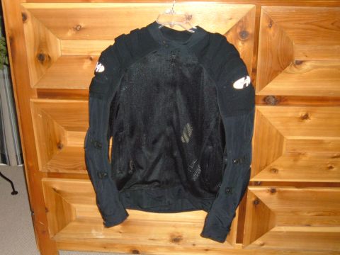 1998 BMW R1100GS ABS - Black mesh motorcycle jacket with white logos on sleeves, hanging on wooden dresser.