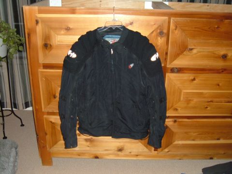 1998 BMW R1100GS ABS - Black Joe Rocket motorcycle jacket hanging on a wooden dresser.