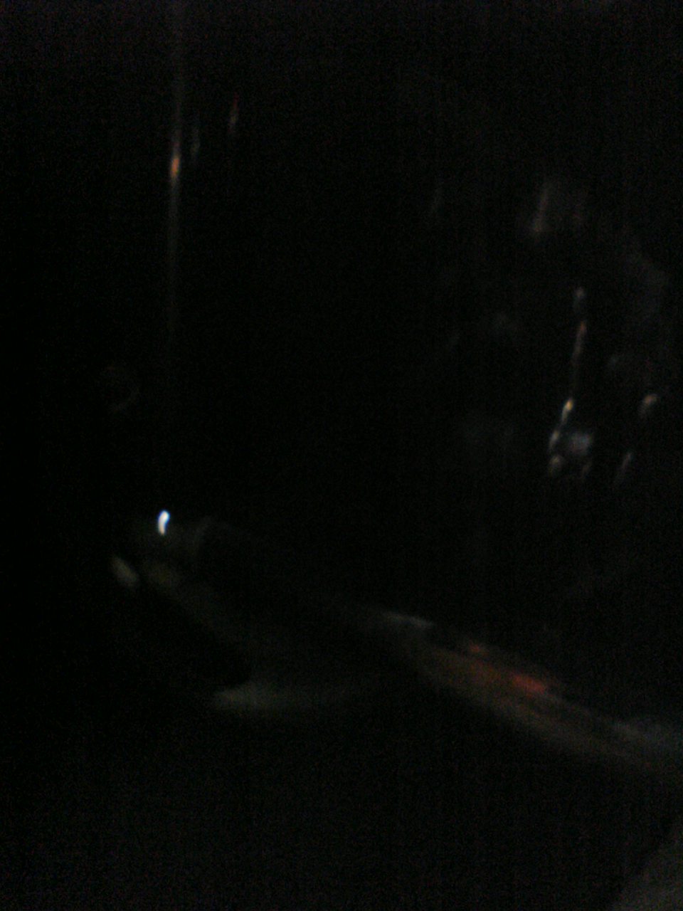 dark interior shot, looks like reflections on a window or dashboard