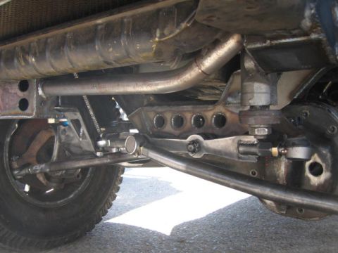 1984 Ford Bronco - Custom front axle and steering components shown from below.
