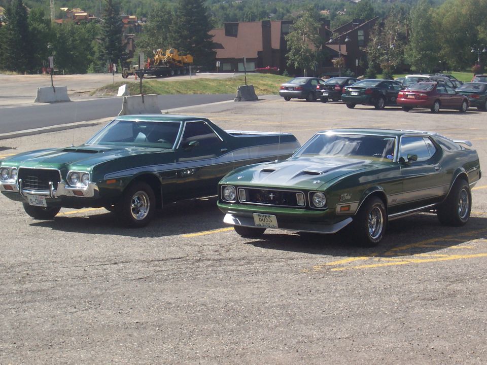 Green 1971 Ford Mustang Mach 1 with a "BOSS" plate
