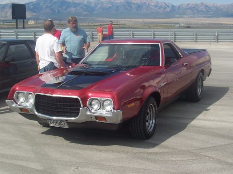 1973 Ford Mustang - Red 1972 Ford Ranchero parked outdoors with mountains in the background.