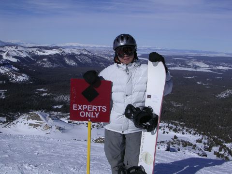 1983 Ferrari Enzo - Snowboarder at a ski resort, with a sign indicating the area is for experts only.
