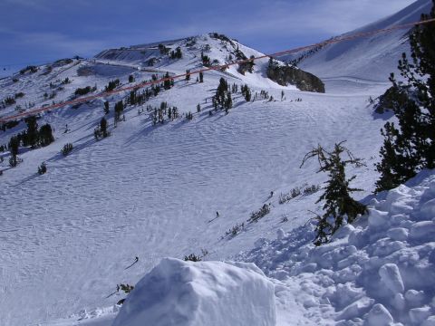 1983 Ferrari Enzo - A wide shot of a ski resort on a clear day, showing groomed slopes and natural terrain.