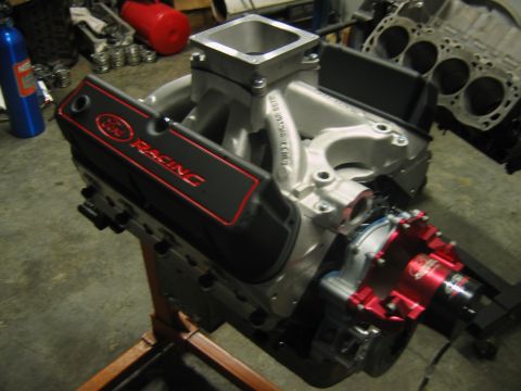1992 Ford Mustang - Close-up of a Ford Racing engine part with a silver intake manifold.
