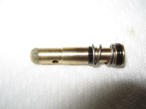 1968 Shelby GT500 - Close-up of a proportioning valve piston, showing its internal components and seals.