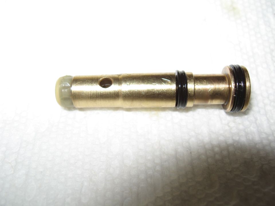Brass proportioning valve with O-rings and a small hole