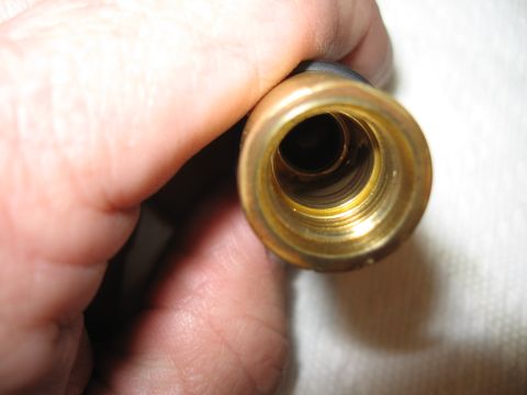 1968 Shelby GT500 - Close-up of a brass fitting with internal threads.