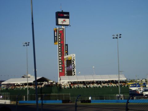 2000 Ford E350 - A view of a racetrack's large scoreboard and seating areas under a clear blue sky.