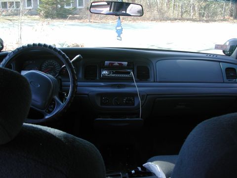 1999 Ford Crown Victoria - Dashboard and interior of a 1998 Ford Crown Victoria, showing the steering wheel and center console.