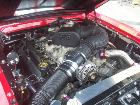 1973 Ford Mustang - Engine bay view of a Ford Triton V10 engine, modified with a large intake system.