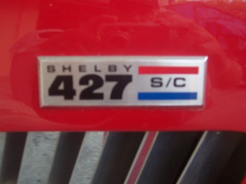 1973 Ford Mustang - Close-up of a Shelby 427 S/C emblem, indicating a high-performance vehicle.