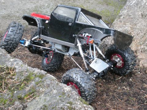 1993 Ford Bronco - A remote control rock crawler navigates a rocky terrain.
