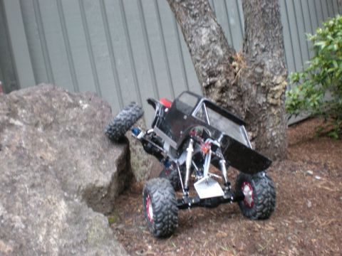1993 Ford Bronco - A remote control rock crawler navigates a rocky obstacle course outdoors.