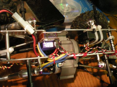 1993 Ford Bronco - Close-up view of an RC car's internal components, including the servo and gearbox.