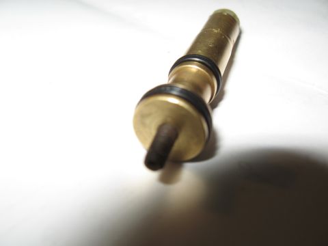 1968 Shelby GT500 - A brass proportioning valve with black O-rings is shown against a white background.