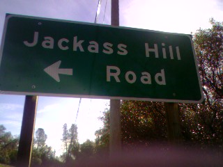 1989 Ford Bronco - A green road sign indicates the direction to Jackass Hill Road.